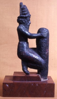 Deity Holding a Foundation Peg