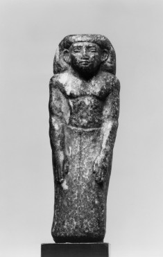 Prophet of Sobk Standing Against a Pillar