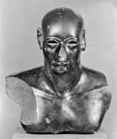 Upper Part of a Statue of a Man