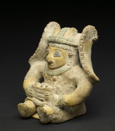 Seated Figure Holding a Box