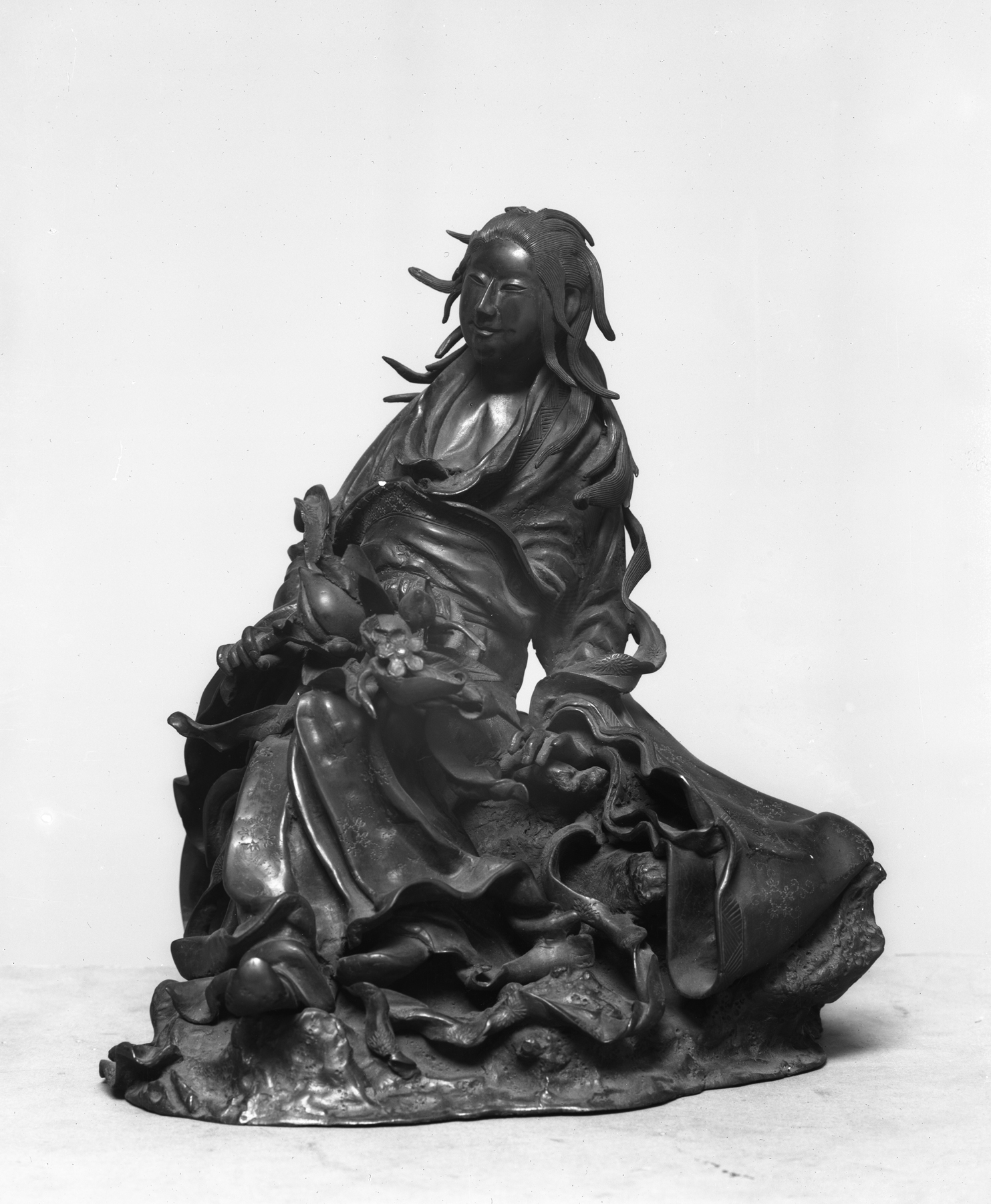 Image for Seated woman with peach branch