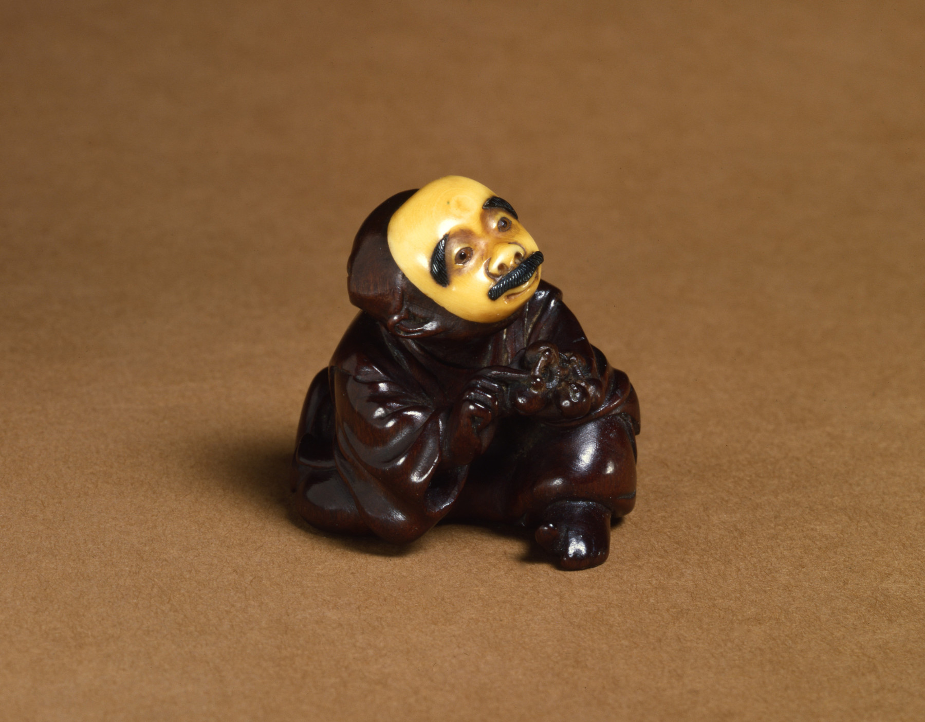 Image for Netsuke of a Man Wearing a Mustached Mask