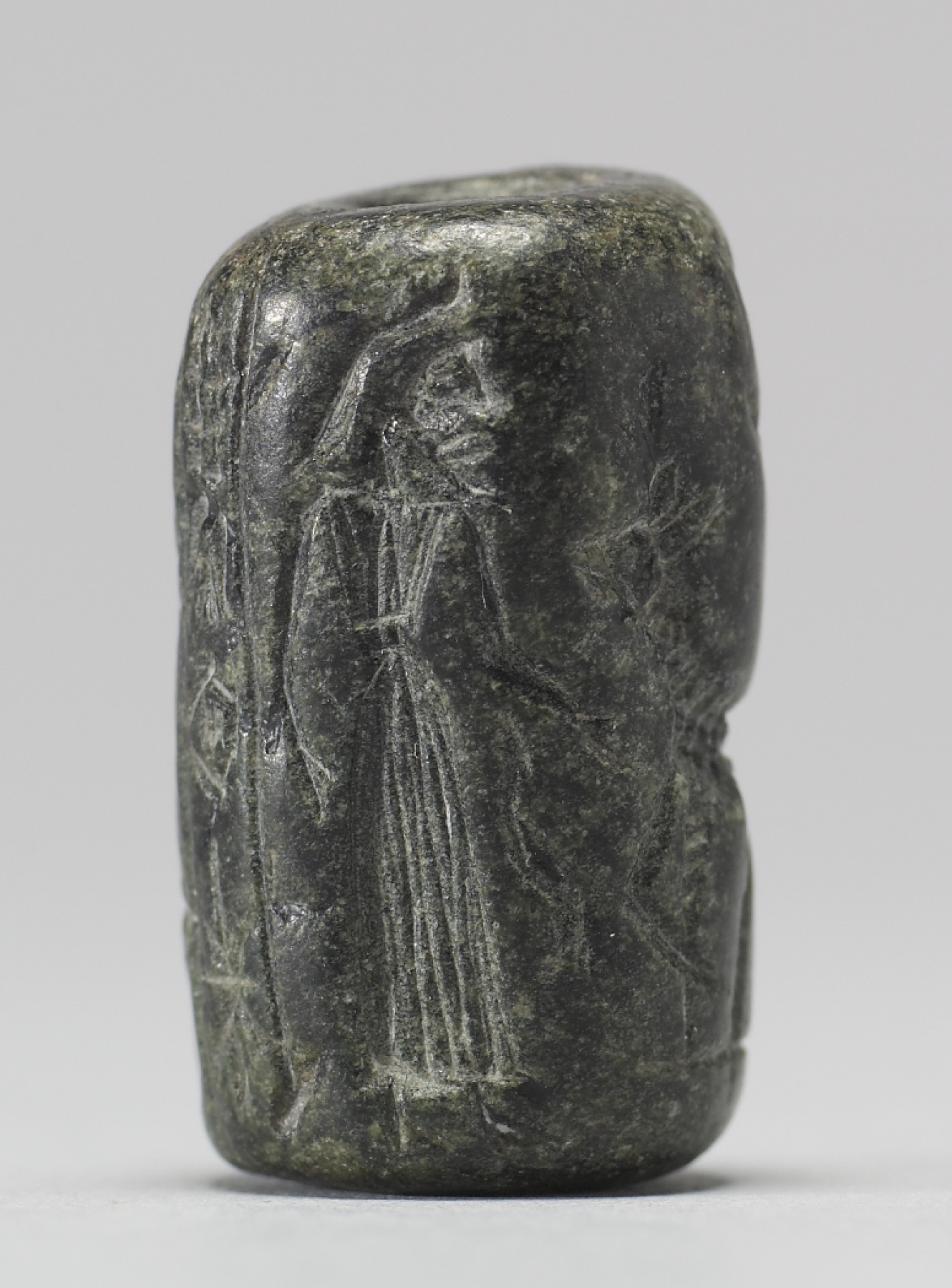 Image for Cylinder Seal with a Figure, Animals, and an Inscription