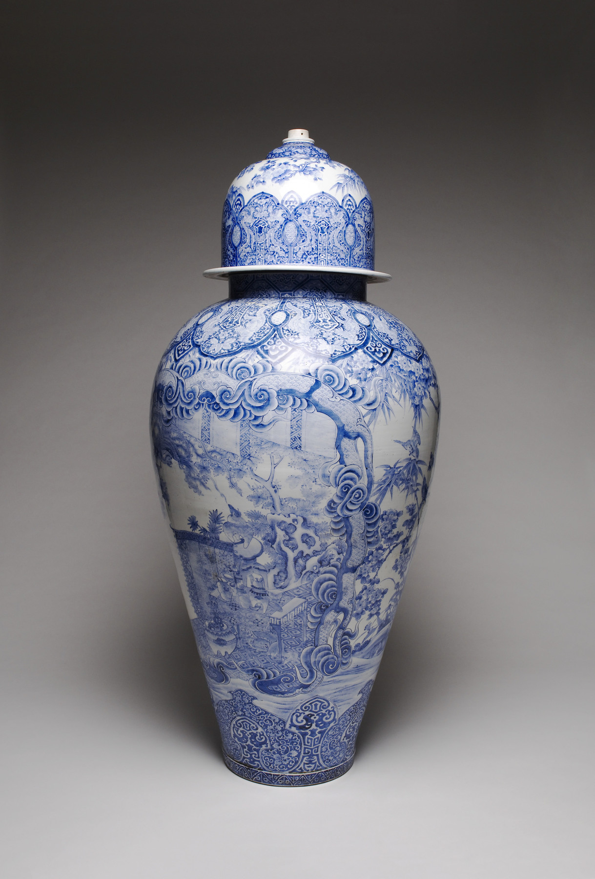 Image for Arita Ware Covered Jar with a Panel Depicting a Collection of Antiques in a Chinese Garden