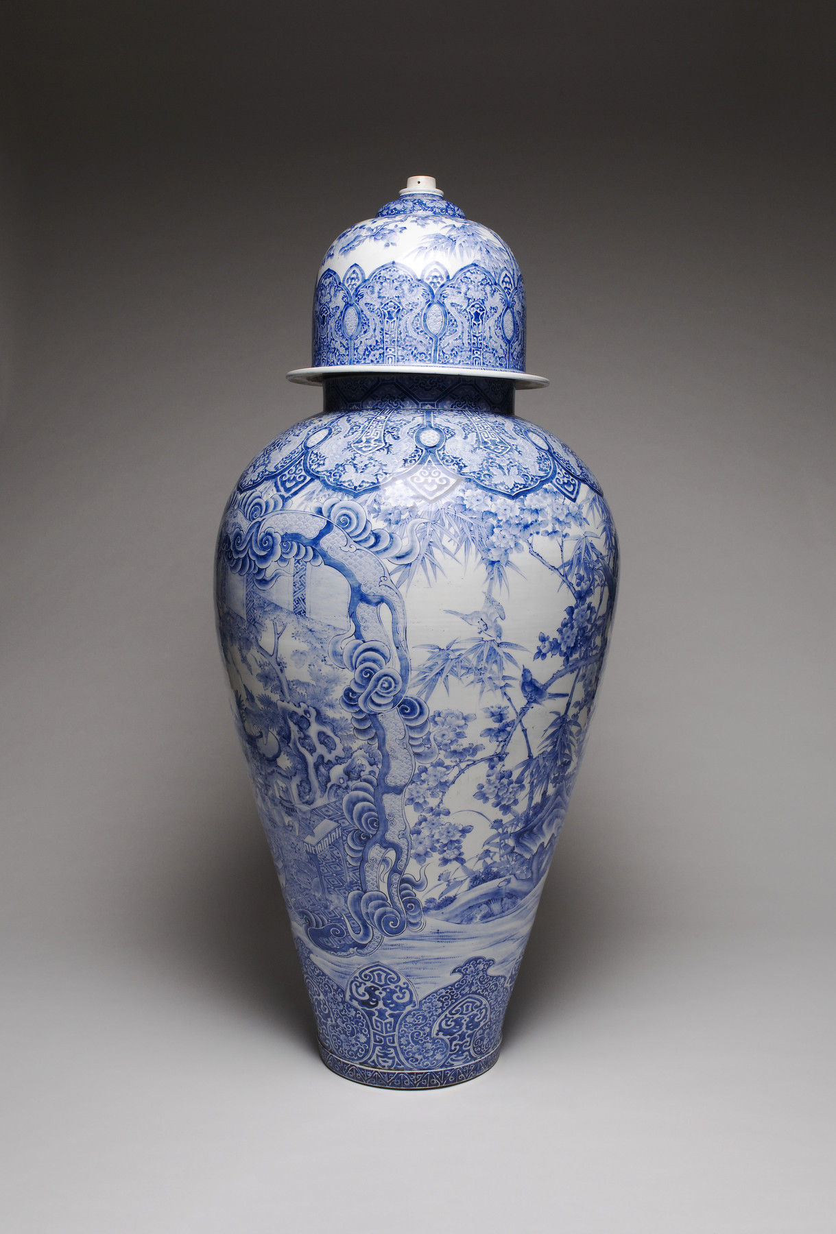 Image for Arita Ware Covered Jar with a Panel Depicting a Collection of Antiques in a Chinese Garden