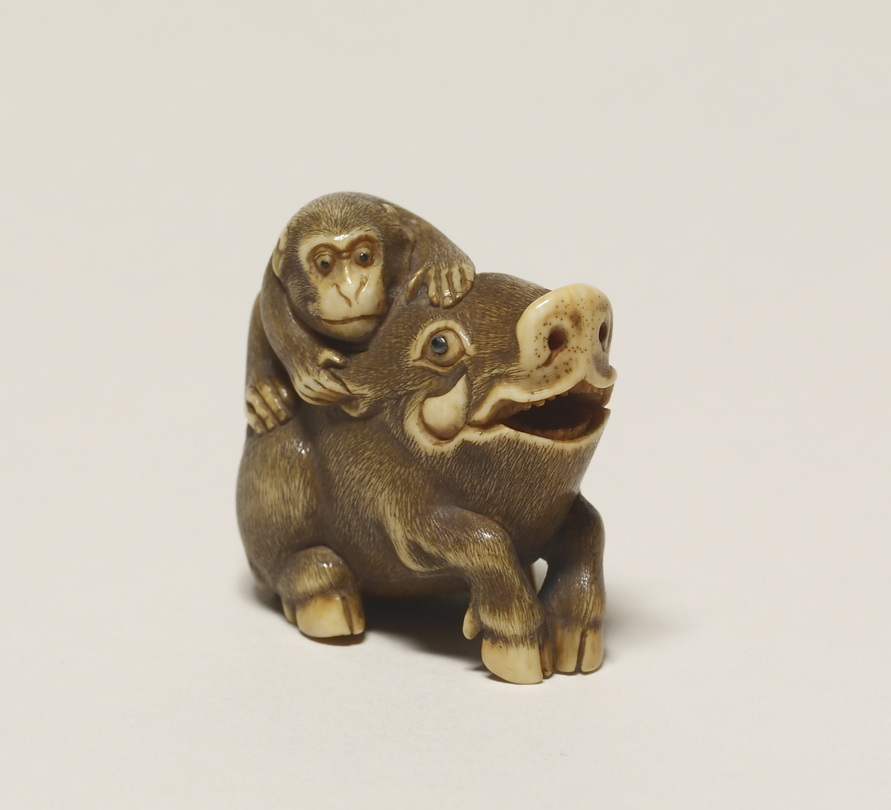 Image for Netsuke of a monkey pulling a wild boar's ear