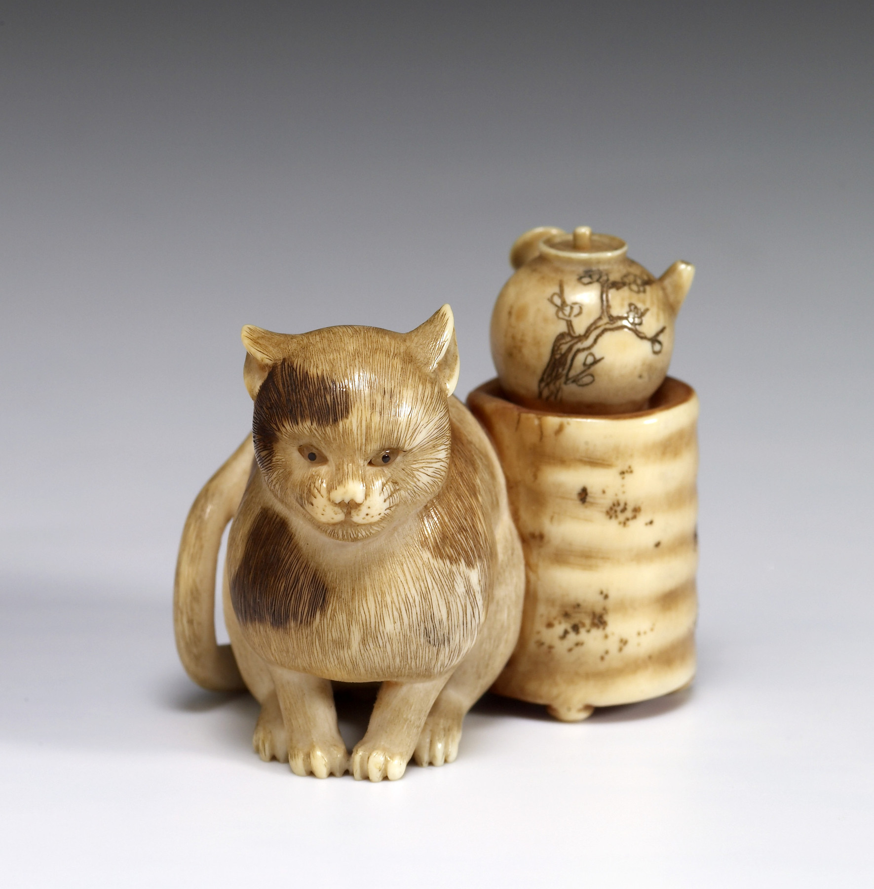 Image for Netsuke of a Cat Warming Himself Next to a Sencha Brazier