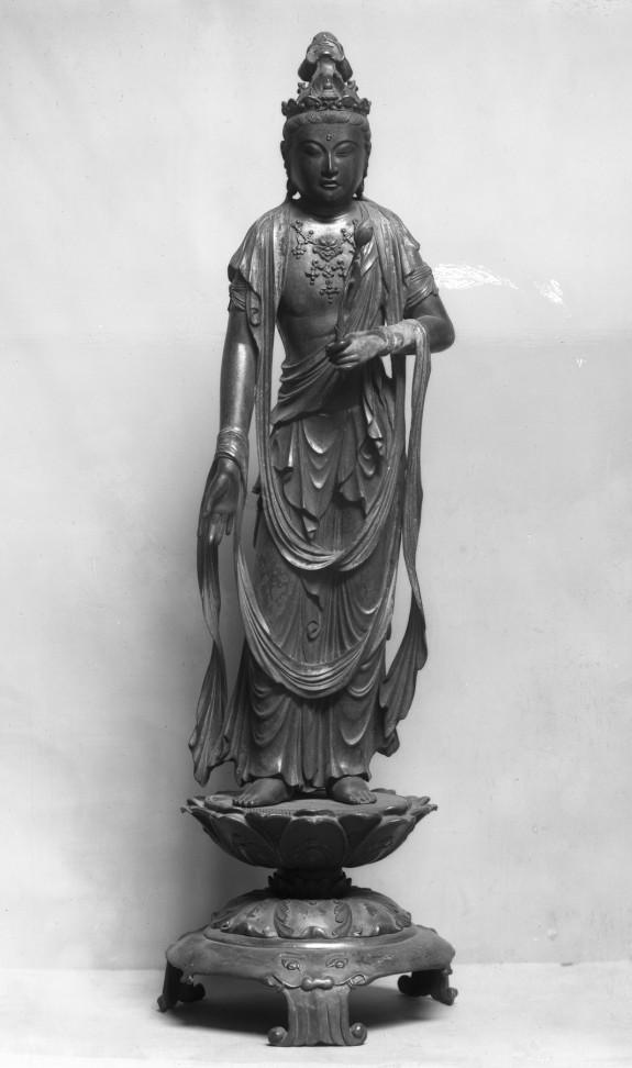 Kannon standing on a lotus pedestal