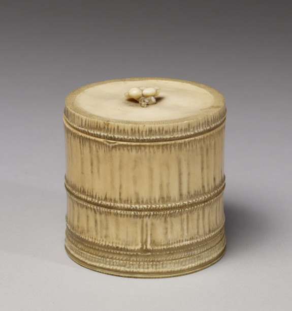 Container in the shape of a bamboo section with a plum blossom knop on lid