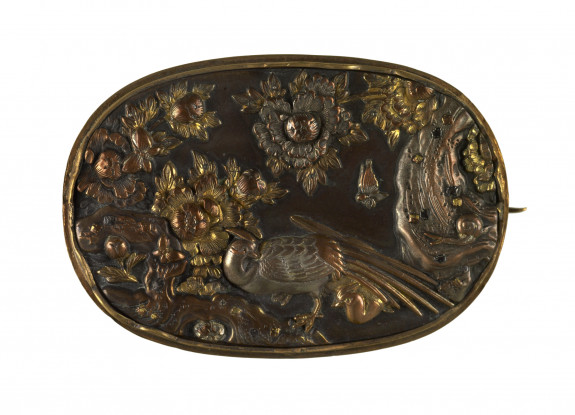 Brooch with peacock, flowers and rockery