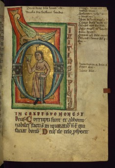Initial "D" with man holding a sword and cup