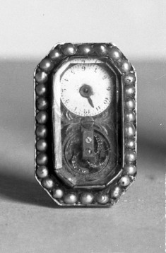 Watch set in face of a brooch