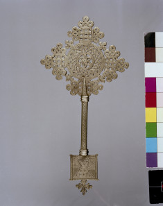 Ethiopian Hand Cross Decorated with the Face of a Saint and Strapwork