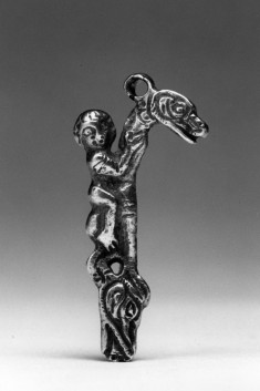 Silver pendant with boy riding a dragon
