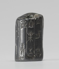 Cylinder Seal Fragment with Standing Figures and an Inscription
