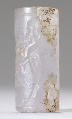 Cylinder Seal with a Winged Genius and Human-Headed Lions