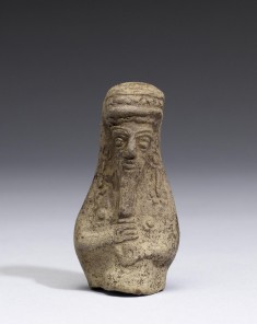 Male Figure Holding a Vase
