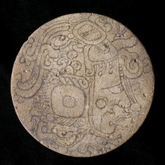 One of a Pair of Maya Painted Earflares with Profile Deity Heads