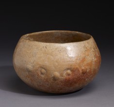 Bowl with faces on two sides