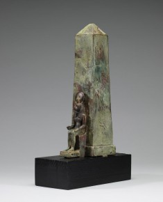 Figure of a Lion-Headed Goddess in Front of an Obelisk