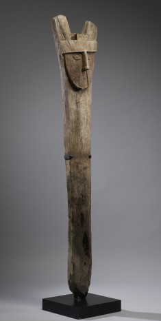 Post with Carved Faces