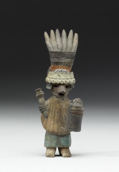 Female Performer Holding Drum and Striker or Rattle