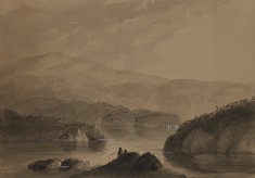 View of Men Fishing from a Rock in a Lake