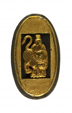 Oval shaped container with nine panels with figures in relief