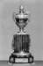 Clock in form of urn on truncated fluted column Thumbnail