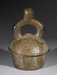 Stirrup spout vessel with supernatural being's head Thumbnail