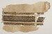 Tiraz fragment with decorative bands and inscriptions Thumbnail