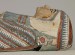 Thumbnail: Mummified Human Remains of a Woman Inside a Painted Cartonnage