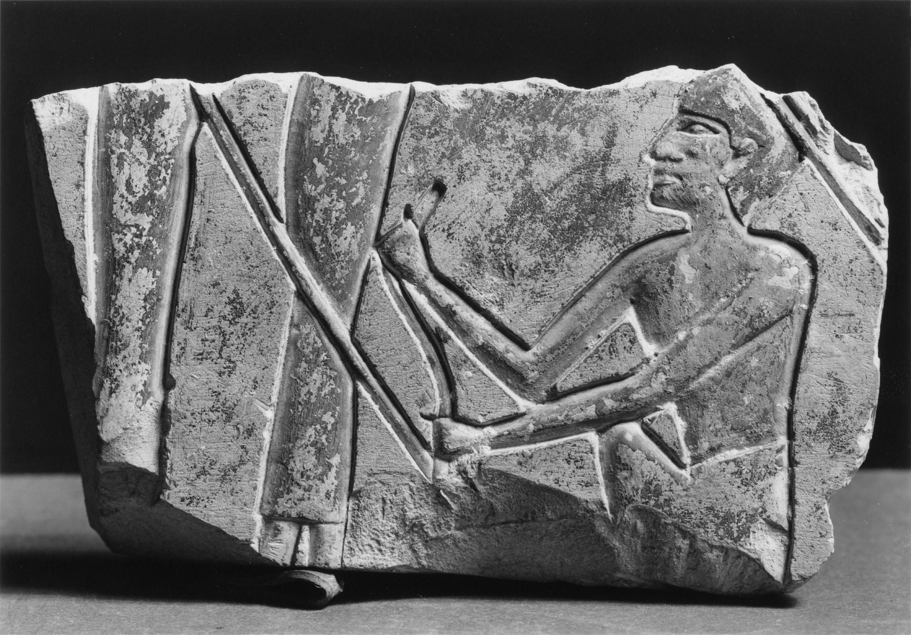 Relief Fragment with a Squatting Male Figure and Two Female Figures