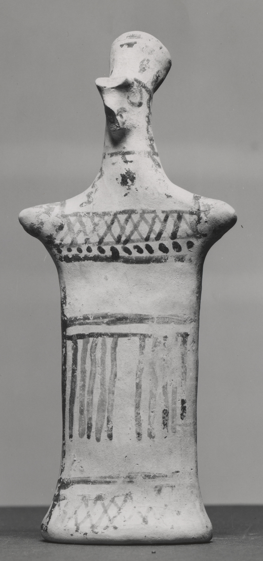 Figurine with Pinched Face and Geometric Decorations