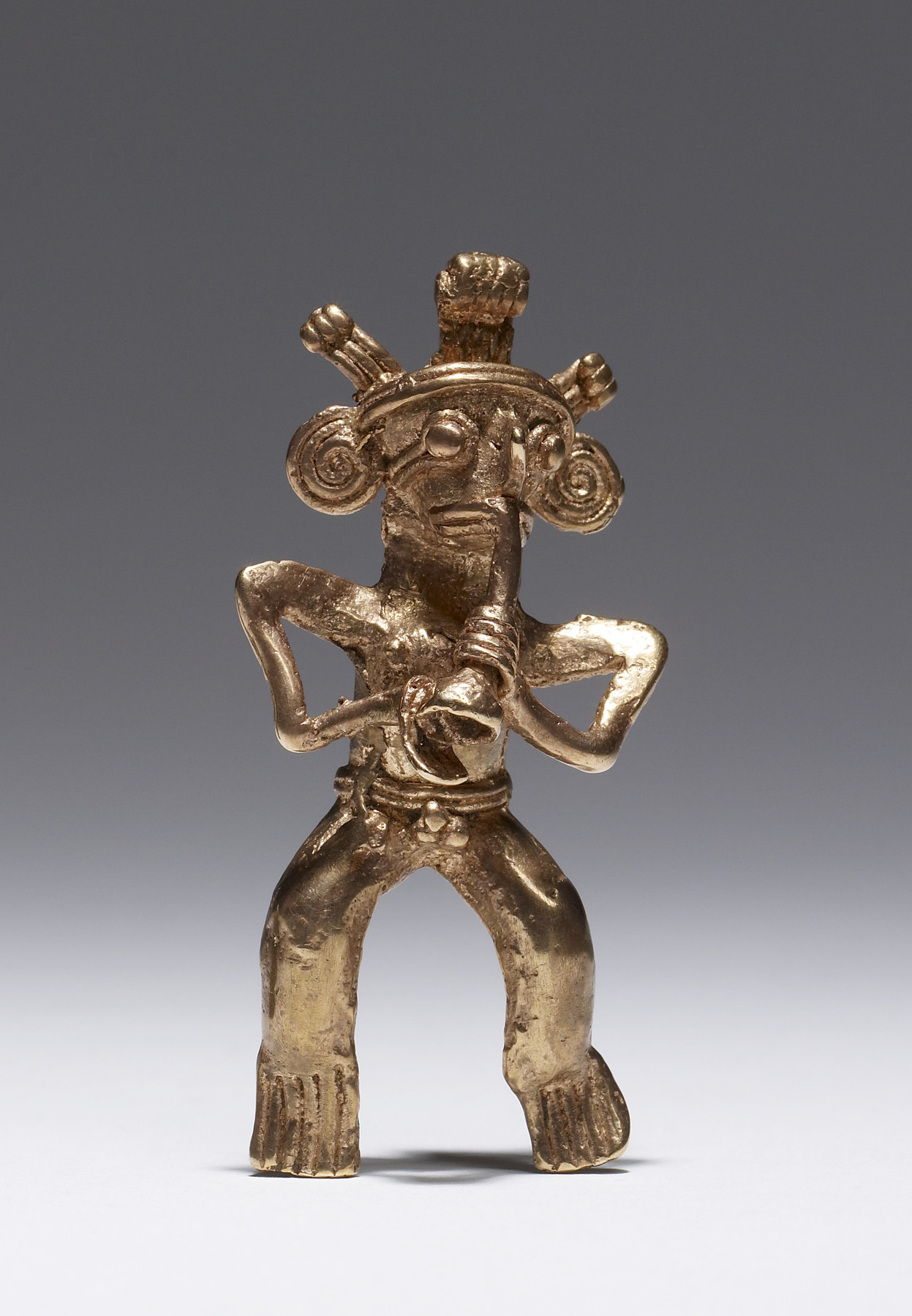 Pendant of Musician with Feather Headdress Playing an Instrument
